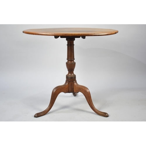 83 - A 19th Century Oak Snap Top Tripod Table, 79cms Diameter