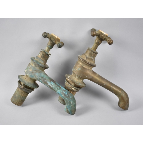 92 - A Pair of Late Victorian/Edwardian Brass Bathroom Taps by Gibbings and Dacre, 22cms High