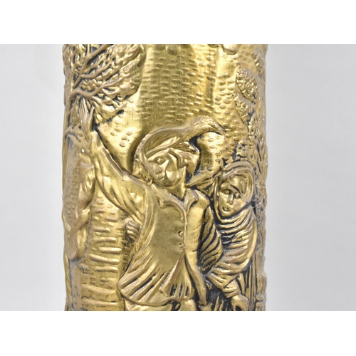 93 - A Mid 20th Century Pressed Brass Cylindrical Stick Stand Decorated with Tavern Scene, 47cms High