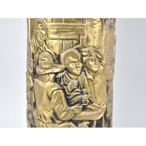 93 - A Mid 20th Century Pressed Brass Cylindrical Stick Stand Decorated with Tavern Scene, 47cms High