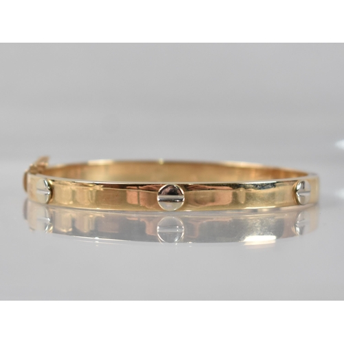 78 - A 9ct Gold Hinged Bracelet having White Metal Raised Stylised Screw Head Embellishments in the Round... 