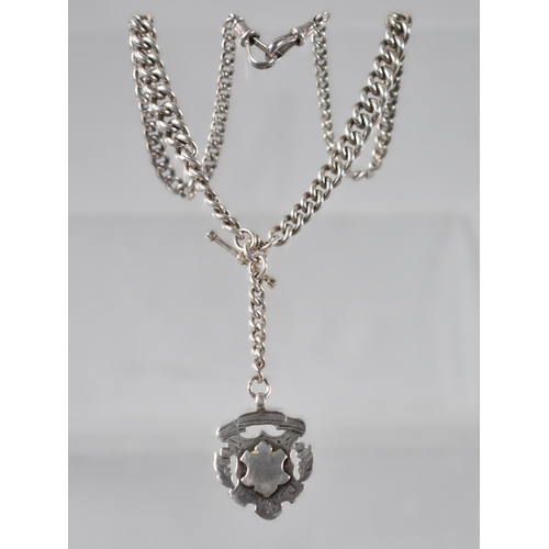 18 - A Late 19th/Early 20th Century Silver Graduated Curb Link Watch Chain, Terminating in Dog Clip Clasp... 