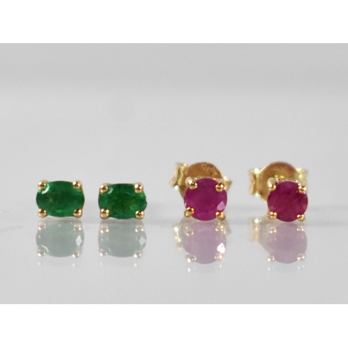 86 - A Pair of Emerald and 9ct Gold Earrings together with a Pair of Ruby and Yellow Metal Earrings, Oval... 