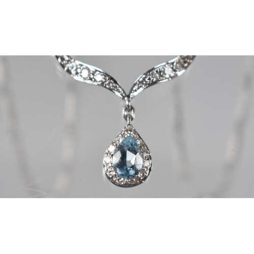 74 - An 18ct White Gold, Topaz and Diamond Set Necklace by Unoaerre, Pear Cut Topaz Set in Five Claws wit... 