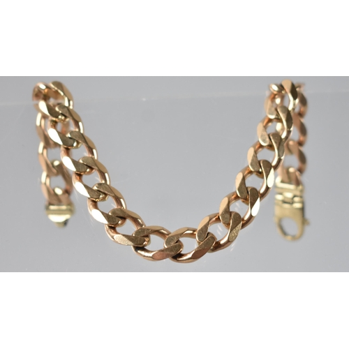 92 - A 9ct Gold Cuban Link Bracelet. 40.5gms, 23cms Long, Stamped for 9ct to Terminals