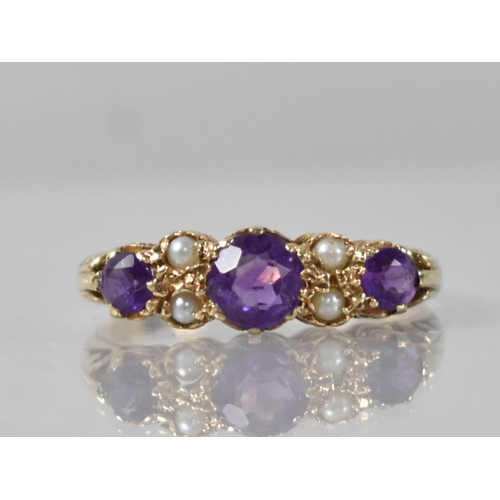 38 - A Vintage Amethyst and Seed Pearl Ladies Boat Style Ring, Central Round Cut Stone Measuring 5.5mm Di... 