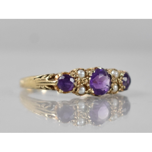 38 - A Vintage Amethyst and Seed Pearl Ladies Boat Style Ring, Central Round Cut Stone Measuring 5.5mm Di... 