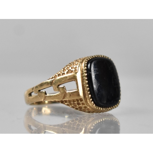 39 - A 9ct Gold and Onyx Signet Ring, Rectangular Onyx Panel Measuring 9.5mm by 11.5mm, Raised on a Textu... 