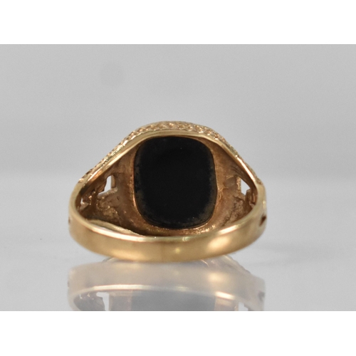 39 - A 9ct Gold and Onyx Signet Ring, Rectangular Onyx Panel Measuring 9.5mm by 11.5mm, Raised on a Textu... 