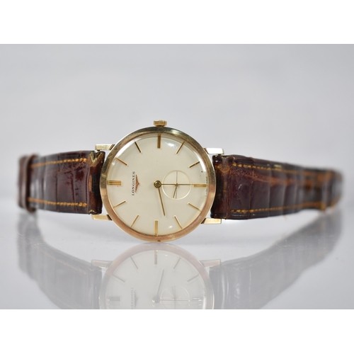 2 - A Late 1950s or Early 1960s Gold Coloured Metal Cased Longines Wristwatch, Champagne Dial with Baton... 