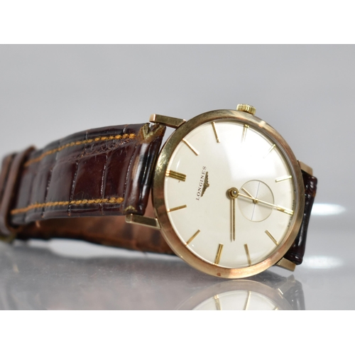 2 - A Late 1950s or Early 1960s Gold Coloured Metal Cased Longines Wristwatch, Champagne Dial with Baton... 