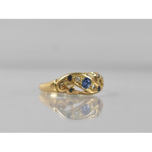 54 - An Early 20th Century 18ct Sapphire and Diamond Ring, Central Mixed Oval Cut Stone Measuring 3.1mm b... 