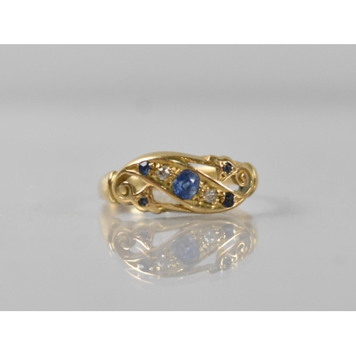 54 - An Early 20th Century 18ct Sapphire and Diamond Ring, Central Mixed Oval Cut Stone Measuring 3.1mm b... 