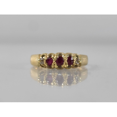 55 - A Victorian 18ct Gold, Ruby and Diamond Ring, Three Old Mixed Round Cut Rubies in Raised Claw and Te... 