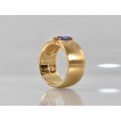 25 - A Contemporary 18ct Gold, Diamond and Tanzanite Ring, Central Marquise Cut Stone Measuring 5.02 by 9... 