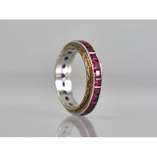 58 - An Early 20th Century Ruby Eternity Ring, Channel Set, Mixed Step Cut Stones Each Measuring Approx 2... 