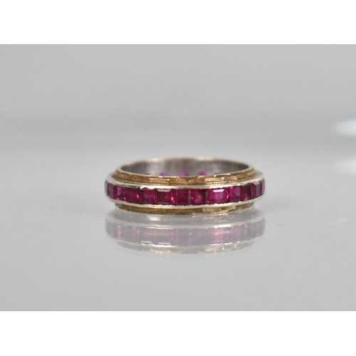 58 - An Early 20th Century Ruby Eternity Ring, Channel Set, Mixed Step Cut Stones Each Measuring Approx 2... 