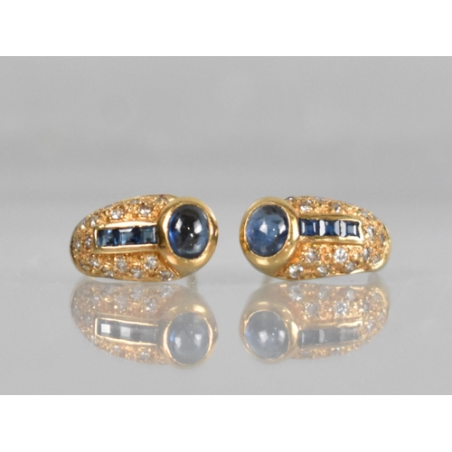 136 - A Pair of Sapphire and Diamond Earrings in the Egyptian Revival Taste, Oval Cabochon Stone Measuring... 