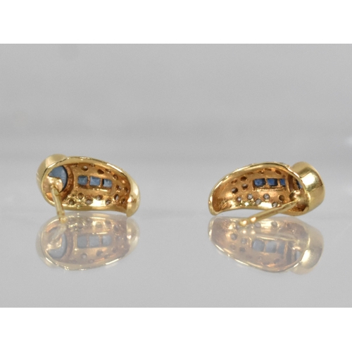 136 - A Pair of Sapphire and Diamond Earrings in the Egyptian Revival Taste, Oval Cabochon Stone Measuring... 