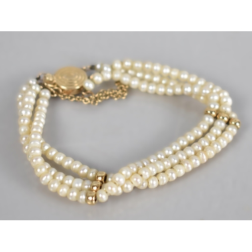 140 - A 14ct Gold Mounted Triple Row Pearl Bracelet, Each Matched Pearl Approx 3.5mm by 2.9mm, 14ct Gold T... 