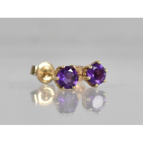 144 - A Pair of 9ct Gold and Amethyst Earrings, Stone Measuring 5mm Diameter and Supported in Six Yellow M... 