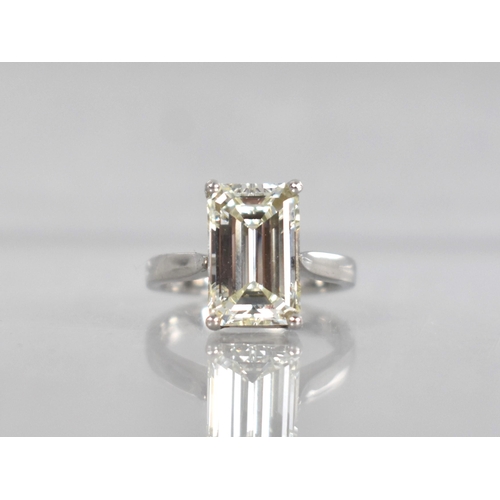 A Diamond Solitaire Ring, Emerald Cut Stone Weighing 4.57cts with Measurements 12.44mm by 8.01mm by 5.08mm, VVS 2 Clarity, L Colour, Complete with AnchorCert Certificate, Supported in Four Claws to Reverse Tapered Shoulders, Stamped Internally 950, and with Makers Mark HM, Birmingham Hallmark, 6.9gms, Size L.5