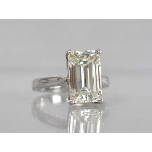 27 - A Diamond Solitaire Ring, Emerald Cut Stone Weighing 4.57cts with Measurements 12.44mm by 8.01mm by ... 