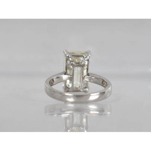 27 - A Diamond Solitaire Ring, Emerald Cut Stone Weighing 4.57cts with Measurements 12.44mm by 8.01mm by ... 