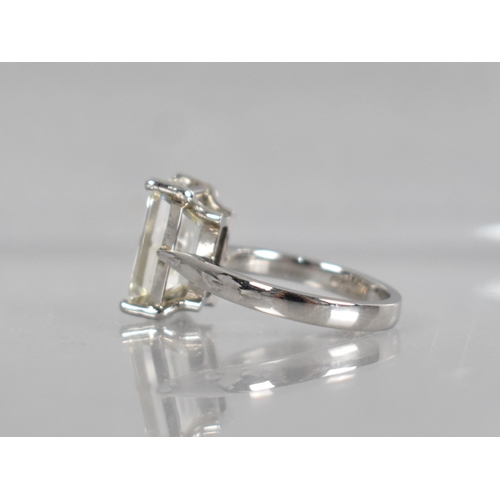 27 - A Diamond Solitaire Ring, Emerald Cut Stone Weighing 4.57cts with Measurements 12.44mm by 8.01mm by ... 