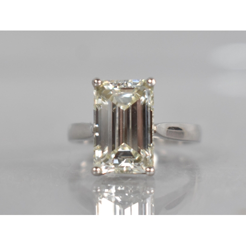 27 - A Diamond Solitaire Ring, Emerald Cut Stone Weighing 4.57cts with Measurements 12.44mm by 8.01mm by ... 