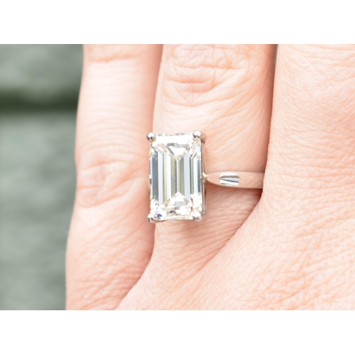 27 - A Diamond Solitaire Ring, Emerald Cut Stone Weighing 4.57cts with Measurements 12.44mm by 8.01mm by ... 