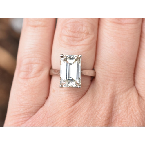 27 - A Diamond Solitaire Ring, Emerald Cut Stone Weighing 4.57cts with Measurements 12.44mm by 8.01mm by ... 