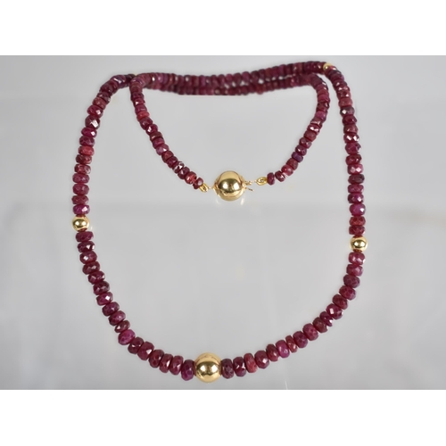 149 - A Ruby Bead Necklace with 18ct Gold Spacers and Clasp, Graduated Faceted Ruby Beads with Largest Mea... 