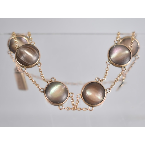 151 - A Six Panel 'Cats Eye' Mother of Pearl Bracelet, Each Panel with Double Sided Circular Cabochon Ston... 