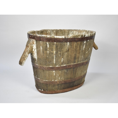 100 - An Early Large Coopered Two Handled Bucket of Oval Form, Perhaps for Peat, 64cm Wide and 50cm High