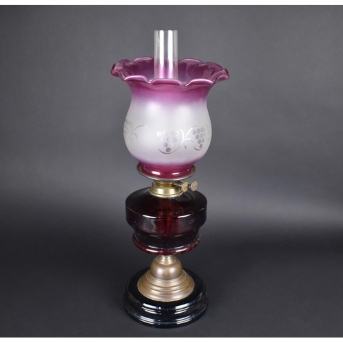 33 - A Late Victorian Brass Based Oil Lamp with Ruby Glass Reservoir and Later Coloured and Etched Shade,... 