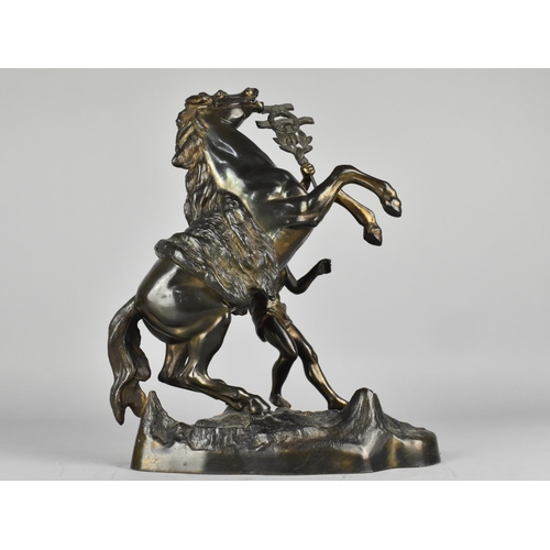 39 - A Bronze Patinated Spelter Marley Horse and Groom, 31cm High