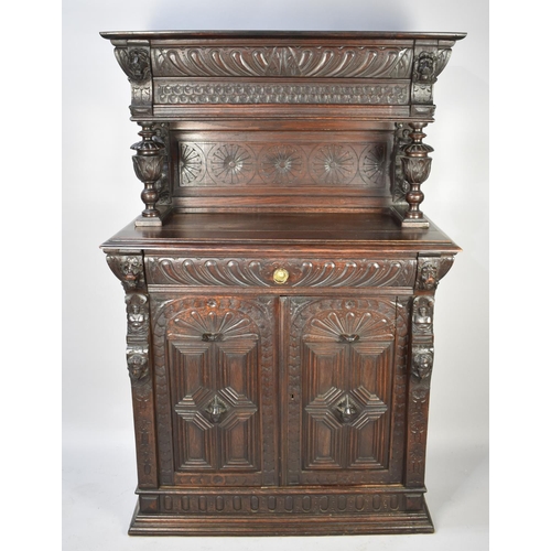 457 - A Continental Oak Side Cabinet with Raised Gallery Top, Carved Bulbous Supports and Carved Panel Doo... 