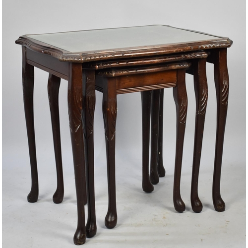 488 - A Nest of Three Mahogany Tables with Glass Over Tooled Leather Panels, 54cm wide