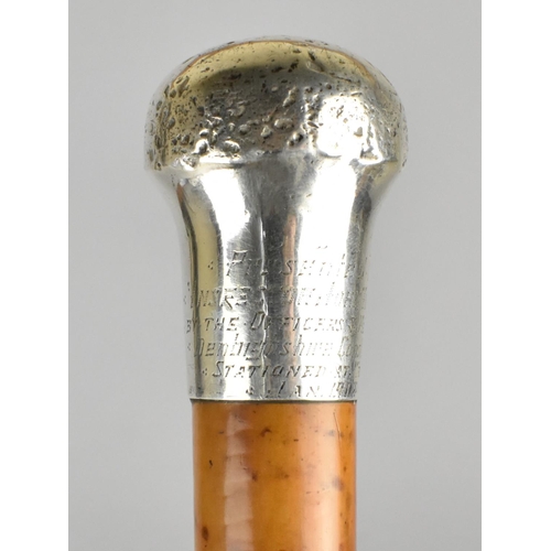 66 - A Silver Topped Malacca Walking Cane, the Handle Engraved 