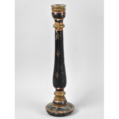 77 - A Turned Wooden Candlestick with Painted and Fleur de Lys Decoration, 46cm High