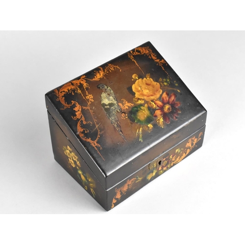 8 - A 19th Century Lacquered Box with Hinged Sloping Lid Decorated with Flowers and Parrot, 15.5cm Wide