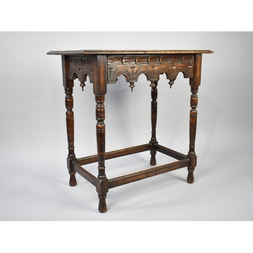 80 - A Gothic Revival Rectangular Side Table with Carved Top and Turned Supports, 76cm Wide