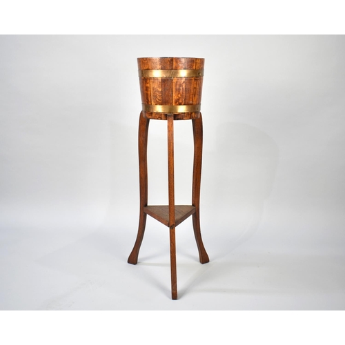 86 - A Mid 20th Century Coopered Oak Plant Stand on Tripod Support, 26cm Diameter and 91cm High