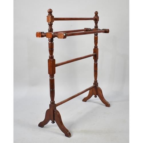 94 - A late Victorian/Edwardian Mahogany Towel Rail, 68cm long