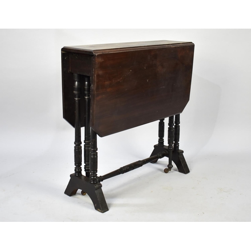 95 - An Edwardian Mahogany Drop Leaf Sutherland Table with Turned Supports, 61cm Long