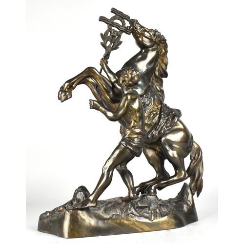 39 - A Bronze Patinated Spelter Marley Horse and Groom, 31cm High