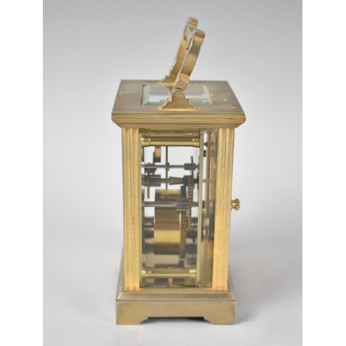 12 - A Mid 20th Century Brass Cased Carriage Clock, the White Enamel Dial inscribed Messell and Hilton, H... 