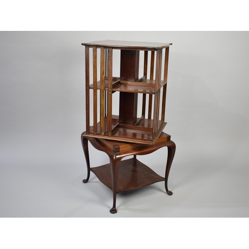 22 - A Small Edwardian Mahogany Revolving Bookcase on Cabriole Supports, 86cm High and 40cm Square