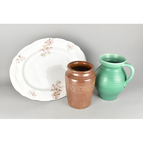 245 - An Edwardian Transfer Printed Oval Meat Plate, Green Glazed Jug and Treacle Glazed Storage Jar